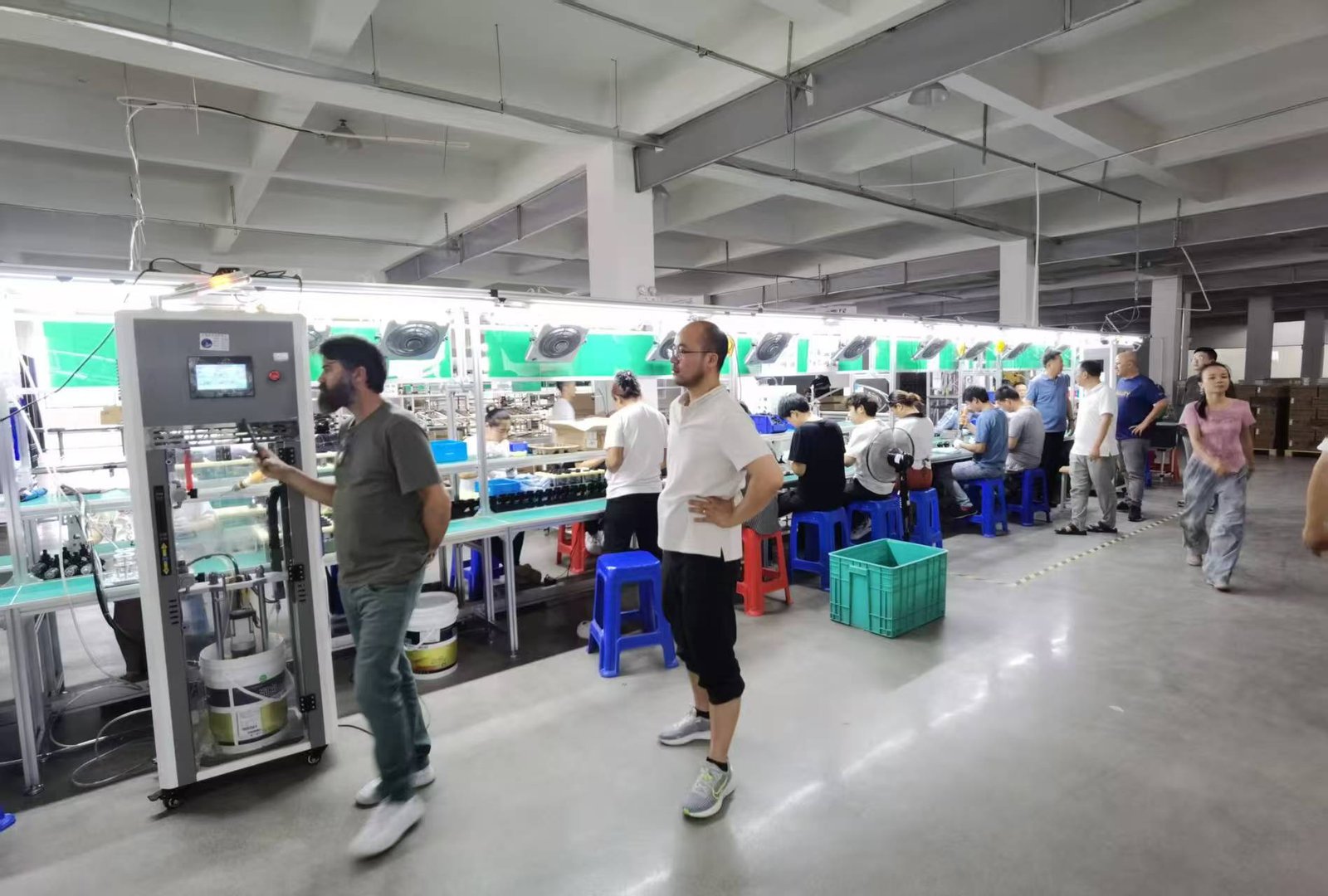 Union Technologies Suzhou cleaning appliance manufacturing workshop, production line for vacuum cleaners and cleaning appliances with client inspection