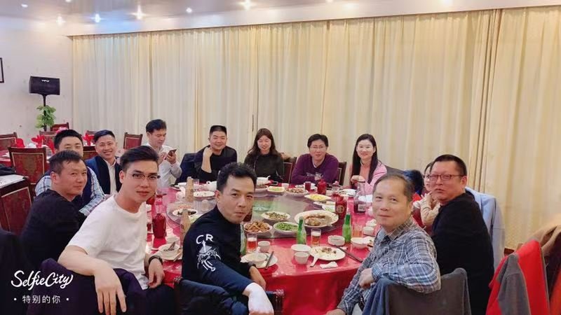 Celebrating contract signing and product selection with clients at team dinner